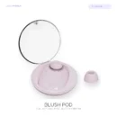 Soft pink Blush Pod clitoral suction vibrator with transparent storage lid and removable silicone head on white.