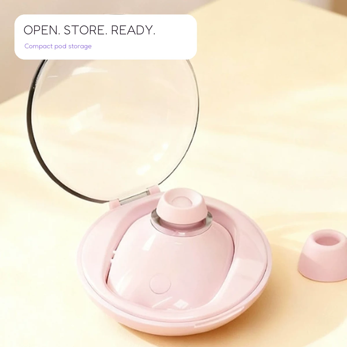 Soft pink Blush Pod resting in its round transparent-lid storage pod.