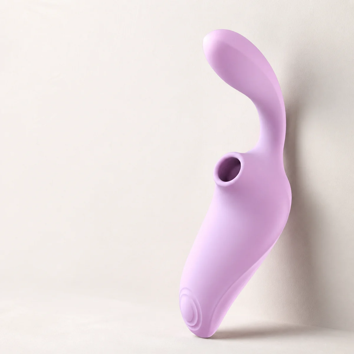 Sculpted curved product silhouette in a warm white studio